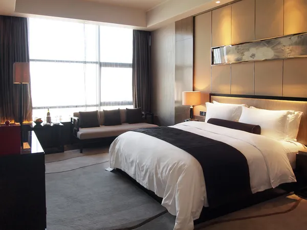 Chambre d'hôtel confortable illustrant la recherche du meilleur prix hôtelier